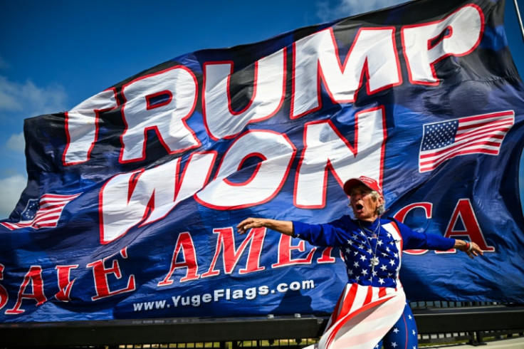 Supporters of Donald Trump celebrate his victory near his Mar-a-Lago resort in Palm Beach, Florida
