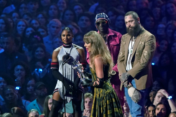 Taylor Swift (C) and Post Malone (R) accept the Best Collaboration award for 'Fortnight' at the MTV VMA awards -- the song earned them several Grammy nods as well