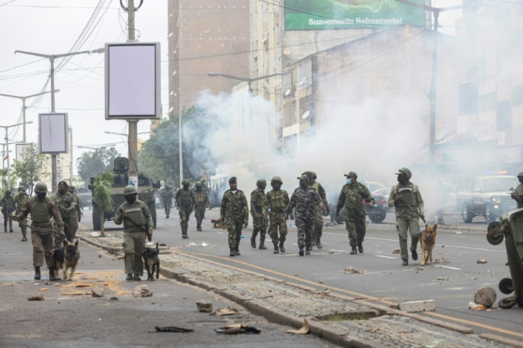 Riot police used dogs and tear gas to disperse the protesters Thursday