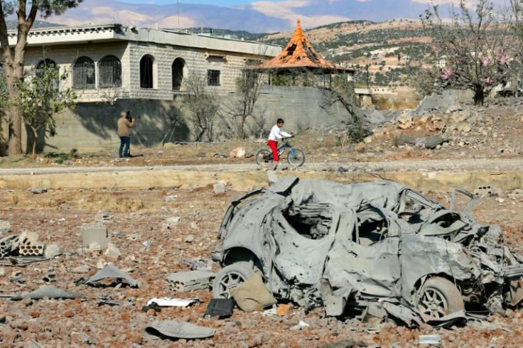 A destroyed car lies among debris a day after Israeli air strikes targeted the Lebanese village of Knaisseh near Baalbek, in Lebanon's eastern Bekaa Valley