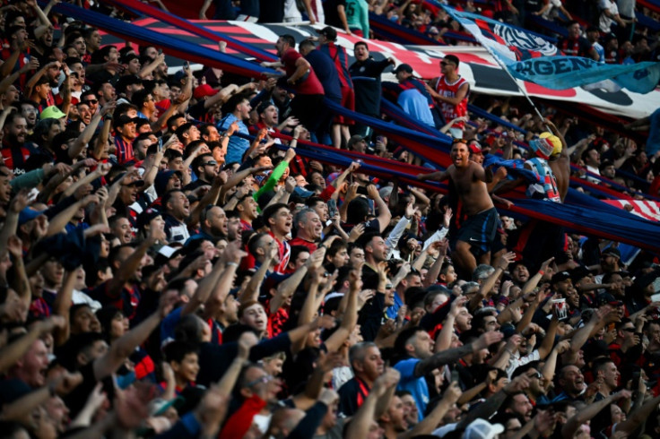 San Lorenzo fans cheer on their team in a match against Estudiantes in the Argentine league, in Buenos Aires, in October
