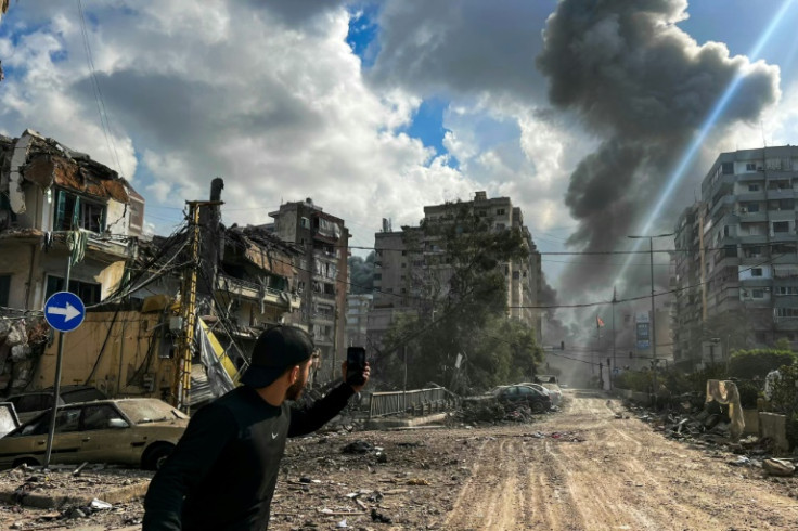 Smoke rises over south Beirut after an Israeli air strike.
