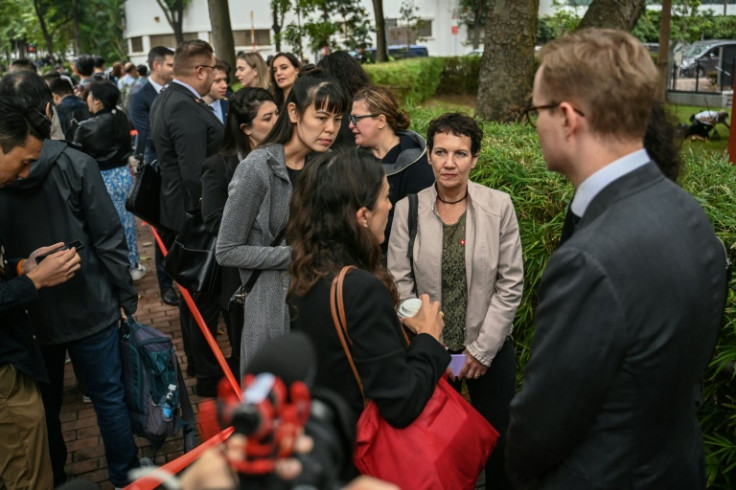 Diplomats queue outside the West Kowloon Magistrates' Court in Hong Kong