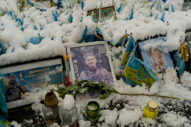 Portraits of Ukrainian soldiers at a makeshift memorial in Independence Square, Kyiv