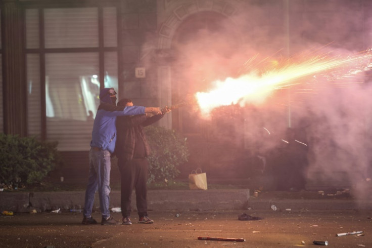 Protestors have launched fireworks towards police, started fires and thrown projectiles, while police have been seen charging into and beating protestors