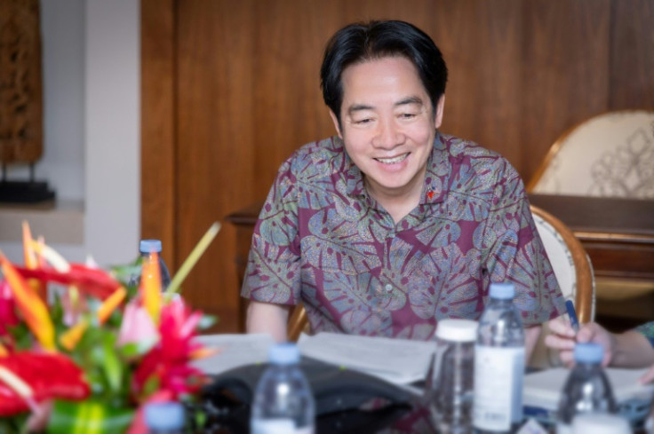 Taiwanese President Lai Ching-te speaks by phone with former US House Speaker Nancy Pelosi, during his visit to Hawaii