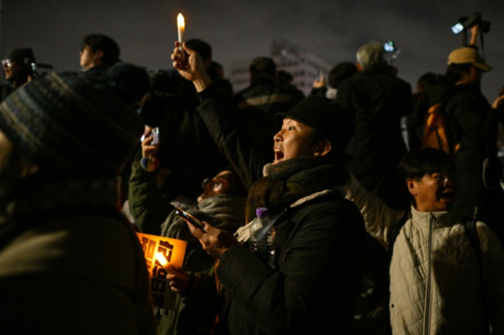 Protesters gather outside the National Assembly in Seoul after South Korea President Yoon Suk Yeol declared martial law