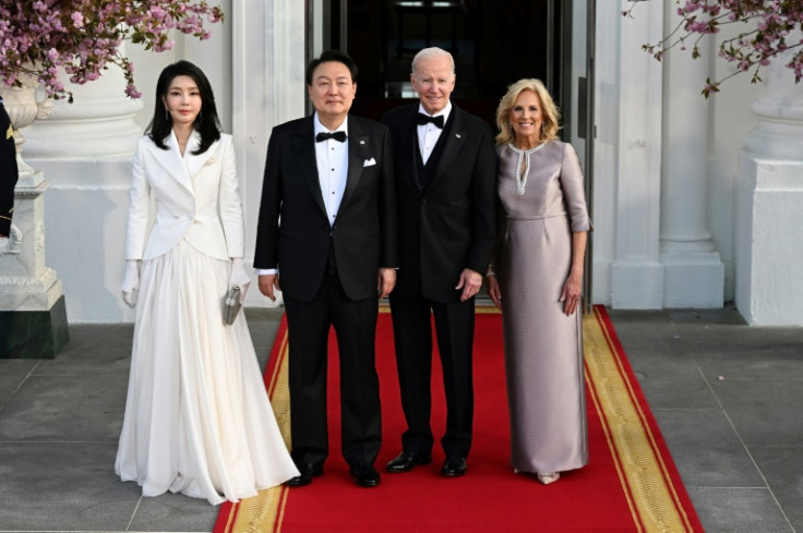 South Korean President Yoon Suk Yeol and his wife Kim Keon Hee pose with US President Joe Biden and First Lady Jill Biden ahead of a State Dinner at the White House on April 26, 2023