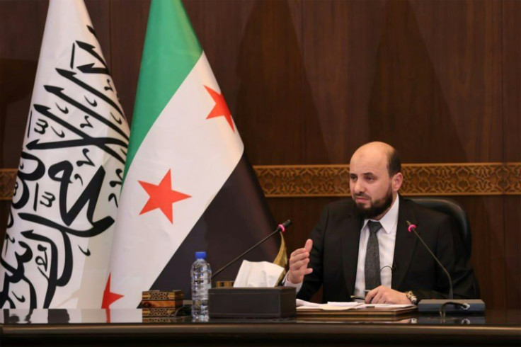 A handout image showing Syria's transitional prime minister Mohammad al-Bashir chairing a cabinet meeting in Damascus