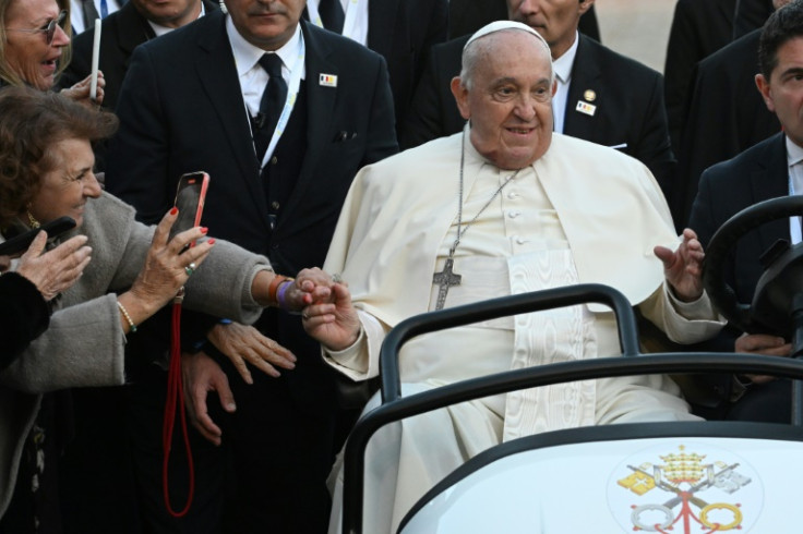 Francis appeared in good spirits, with a ready smile throughout the day's events