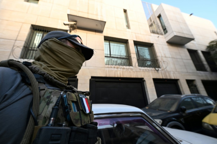 A member of the French military stands guard outside the French embassy building in Damascus