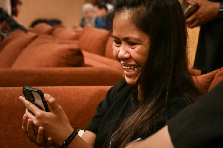 Filipina inmate on Indonesia death row, Mary Jane Veloso speaks on a phone before flying home