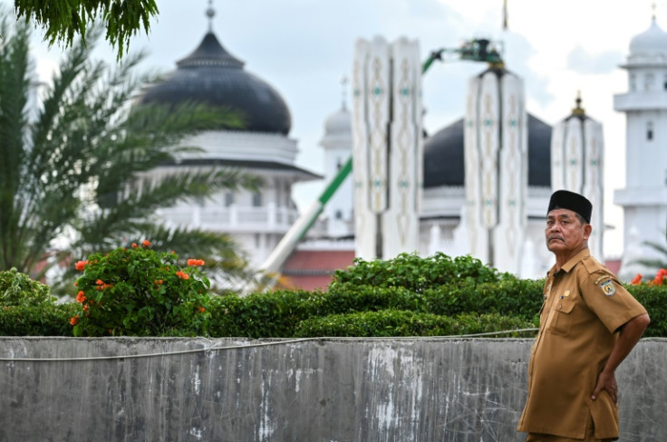 Djafaruddin, a resident of worst-hit city Banda Aceh, jumped in his pickup truck to shift dozens of the dead, some missing limbs and others crushed, to a nearby hospital, leaving him covered in blood and mud