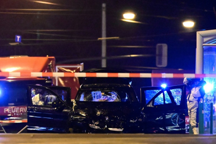 Forensics police inspect the car that rammed into a crowd at a Christmas market in Magdeburg