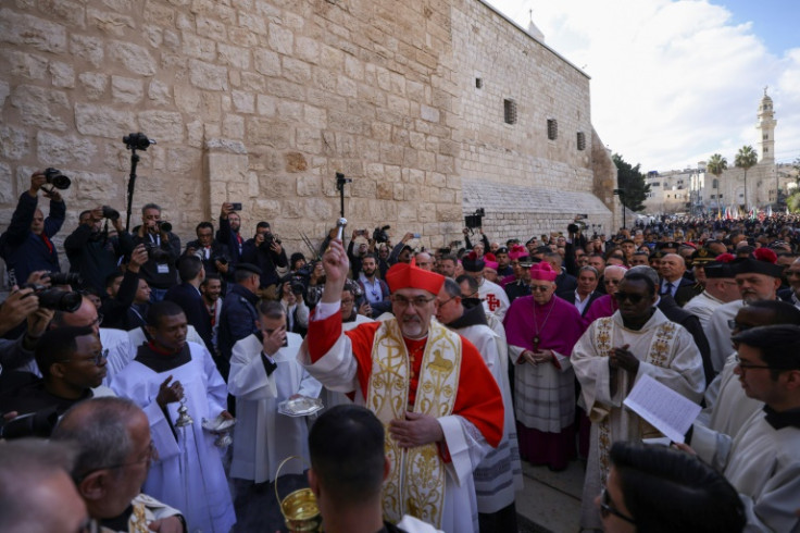 Latin Patriarch of Jerusalem Pierbattista Pizzaballa leads a Christmas procession outside the Church of the Nativity in Bethlehem