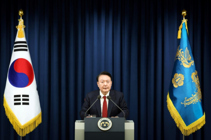 This handout from the South Korean Presidential Office taken on December 3, 2024 shows South Korean President Yoon Suk Yeol delivering a speech to declare martial law in Seoul