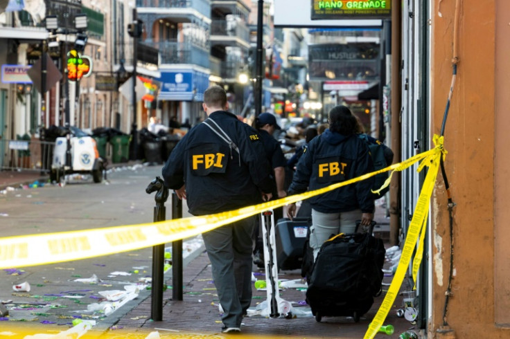 FBI investigators scour the New Orleans scene of a mass casualty attack by a man in a Ford pickup truck, who drove into a New Year's crowd