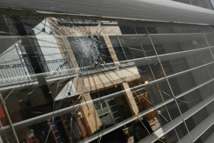 A view of a damaged window on Bourbon Street