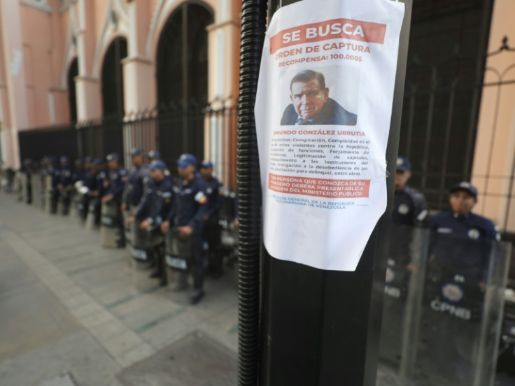 A poster asking for information on Venezuelan opposition leader Edmundo Gonzalez Urrutia is pictured in a pole amid heavy security in Caracas on January 8, 2025