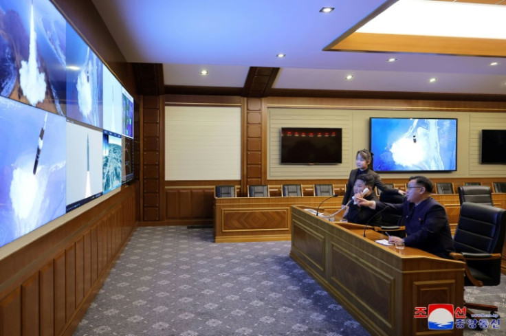 Kim was shown watching last week's launch with his daughter