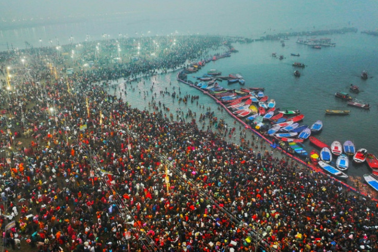 Hindu pilgrims taking a holy dip in the sacred waters of Sangam