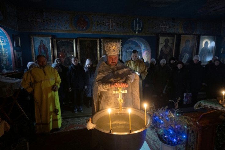 Muffled explosions echoed throughout the Epiphany service in Lyman