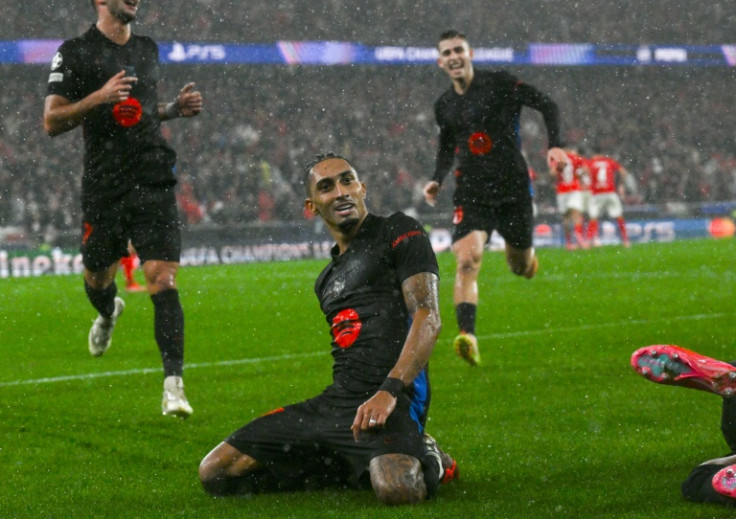 Raphinha celebrates after scoring the winner as Barcelona beat Benfica in a nine-goal thriller
