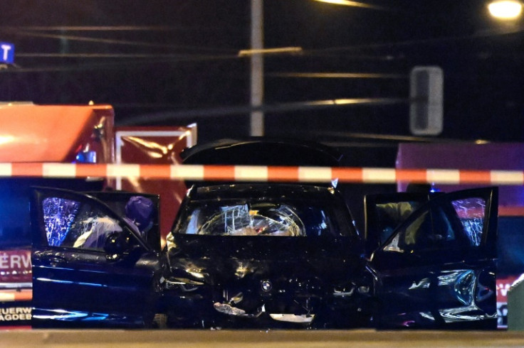 Forensics police inspect the car that rammed into a crowd at a Christmas market in Magdeburg, eastern Germany, on December 21, 2024
