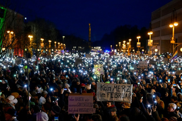 The protesters accused Germany's conservatives of having made a 'pact with the devil' by seeking far-right backing