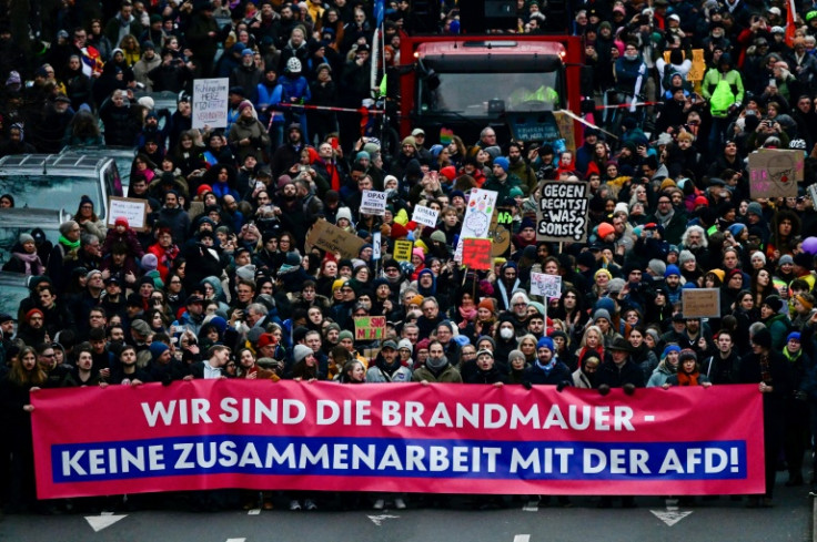 Protesters holding a banner reading 'We are the firewall. No cooperation with the AfD'
