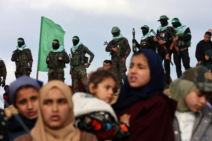 Hamas militants and Gaza residents gathered for the handover of hostages' bodies in Khan Yunis on Thursday