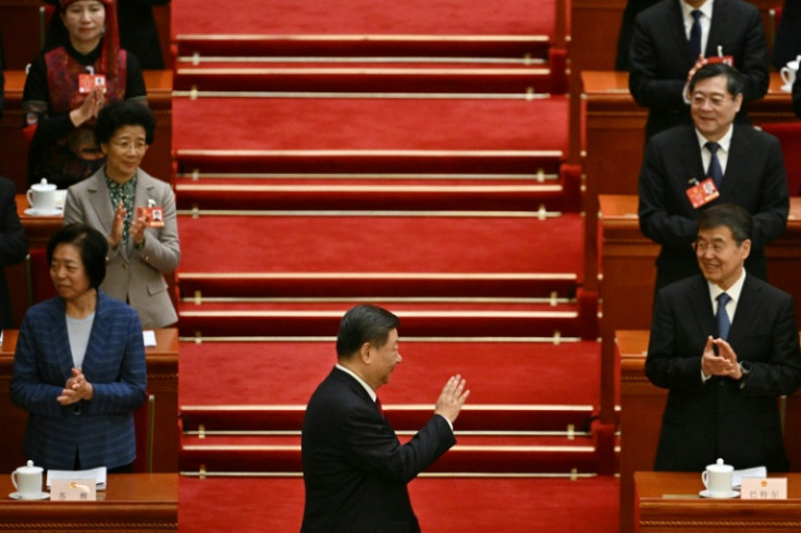 China's President Xi Jinping arrives for the opening session of the National People's Congress (NPC) on Wednesday
