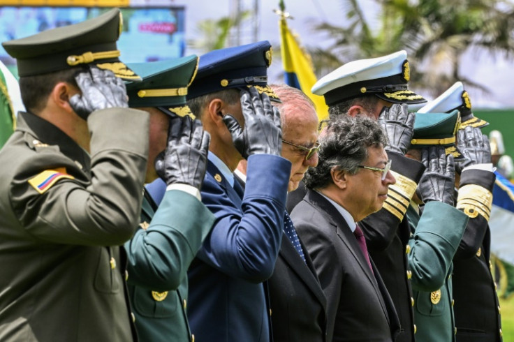 Colombian President Gustavo Petro (4-R) and Colombian Defense Minister Ivan Velasquez (4-L) attend a military ceremony during the swearing-in of the new National Police Director General Carlos Triana at the General Santander Police School in Bogota on Feb