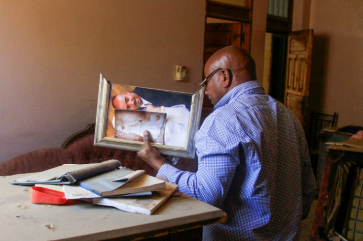 Abdelmoneim Abu Idris Ali's ripped up wedding photograph, which he found on the floor of his home