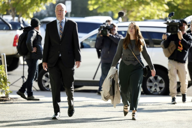 Simon Patterson (L) arrives at court in Morwell where his estranged wife Erin Patterson is on trial charged with three murders, and one attempted murder. She denies all charges