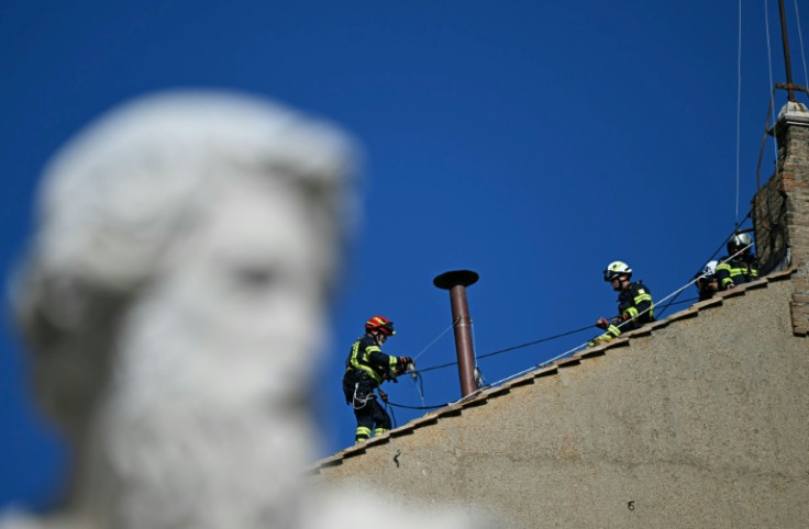 Workers install the chimney on the roof of the Sistine Chapel in The Vatican, on May 2, 2025. Workers at the Vatican began to install a chimney on top of the Sistine Chapel to be used during the conclave that begins May 7, an AFP reporter witnessed on May