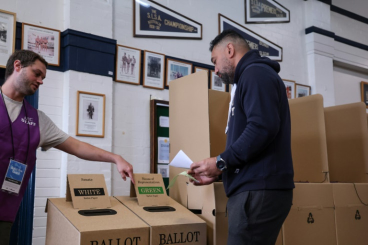 The first polls opened at 8:00 am (2200 GMT) on Australia's east coast, to be followed later by the country's western cities and far-flung island territories