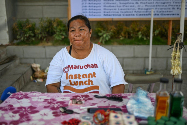 Anna Fernandez, a candle vendor, has been watching the news from Rome with building anticipation, as Philippine Cardinal Luis Antonio Tagle may be one of the favourites to be named the next pope