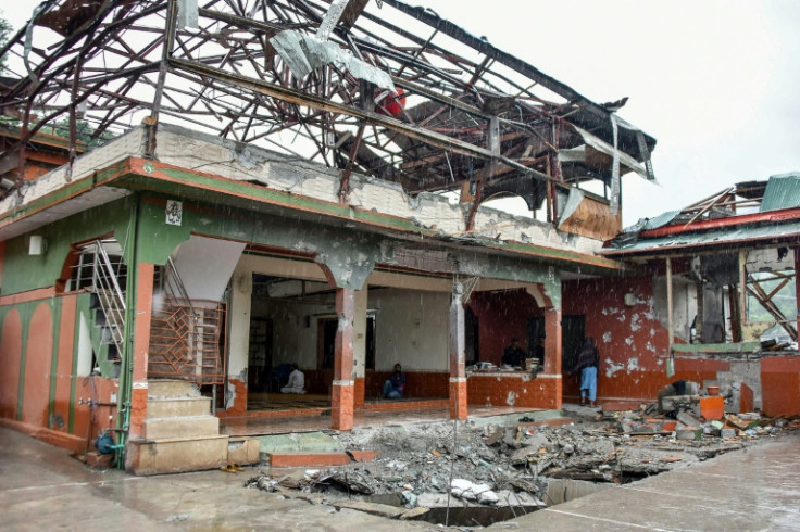 Worshippers held Friday prayers at a mosque in Pakistan-administered Kashmir that was damaged by Indian air strikes