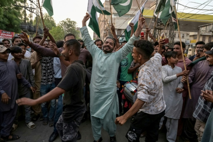 Pakistani people celebrate after the ceasefire between Pakistan and India, in Hyderabad, Sindh province, on May 10, 2025