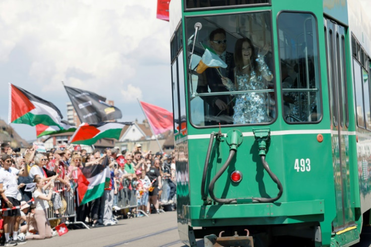 Eurovision competitors parade through Basel on vintage trams