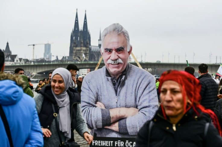 Kurdish demonstrators carry an image of PKK founder Abdullah Ocalan