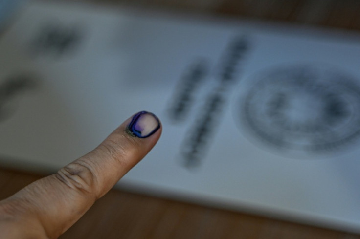 A voter's finger is seen marked with indelible ink after casting their vote on Monday