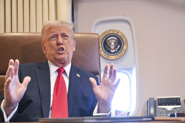 US President Donald Trump speaks to the press after signing a proclamation renaming the Gulf of Mexico as the Gulf of America aboard Air Force One, as it flies over the Gulf enroute to New Orleans, Louisiana on Febrary 09, 2025. For years, as disputes ov