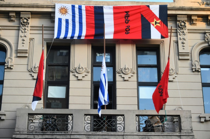 Flags fly at half staff at the Frente Amplio party headquarters in Montevideo following the death of Uruguayan former president Jose 'Pepe' Mujica