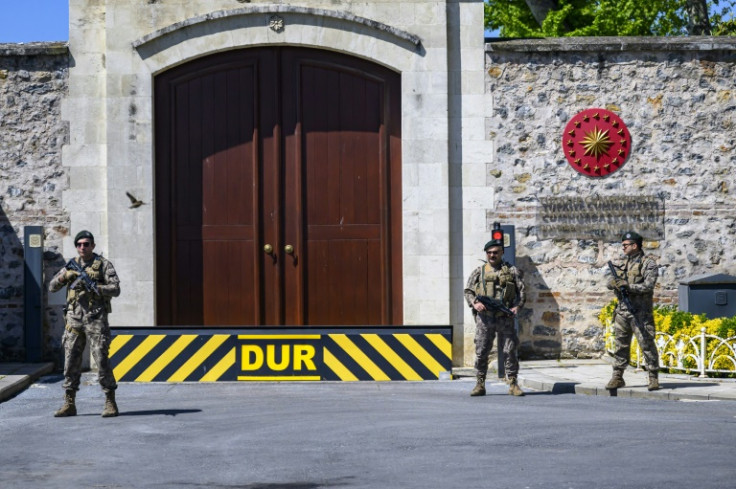 Turkish security personnel stand alert at the entrance to Dolmabahce Palace in Istanbul, where talks between Russia and Ukraine are expected on Friday