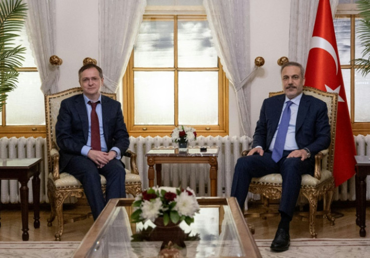 Turkish Foreign Minister Hakan Fidan with Russia's delegation head Vladimir Medinsky at the Dolmabahce Palace in Istanbul