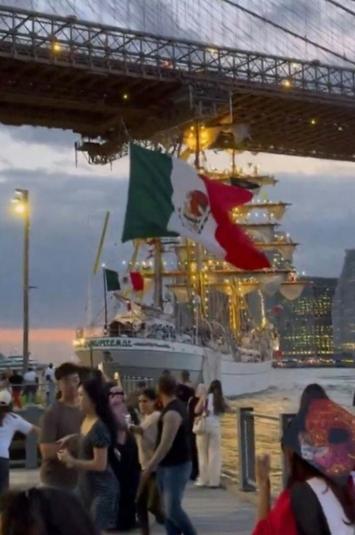 A still image from video taken by Nick Corso, a Brooklyn resident who witnessed the crash, shows the ship gliding backwards beneath the bridge