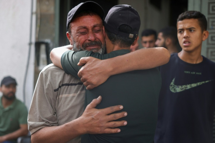 Palestinians mourn relatives killed in Israeli strikes, in Gaza City