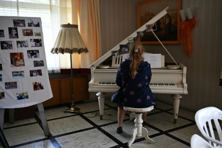 Dorothee Munch, born in Colonia Dignidad, plays the piano in the German-themed settlement and onetime dissident detention center that has become a flashpoint in southern Chile